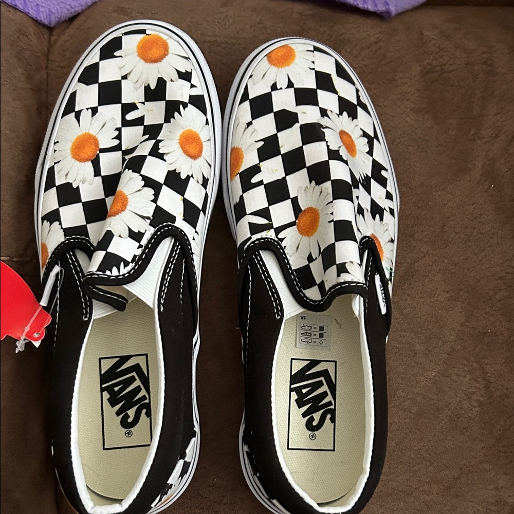 Vans Kids' Black and White Checkered Slip-On Sneakers with Orange Daisies